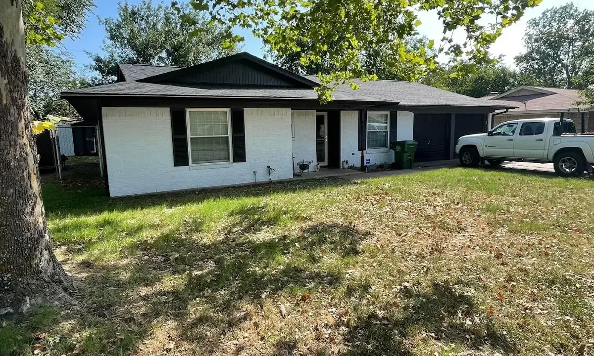Professional roofing crew working on a residential roof in Star
